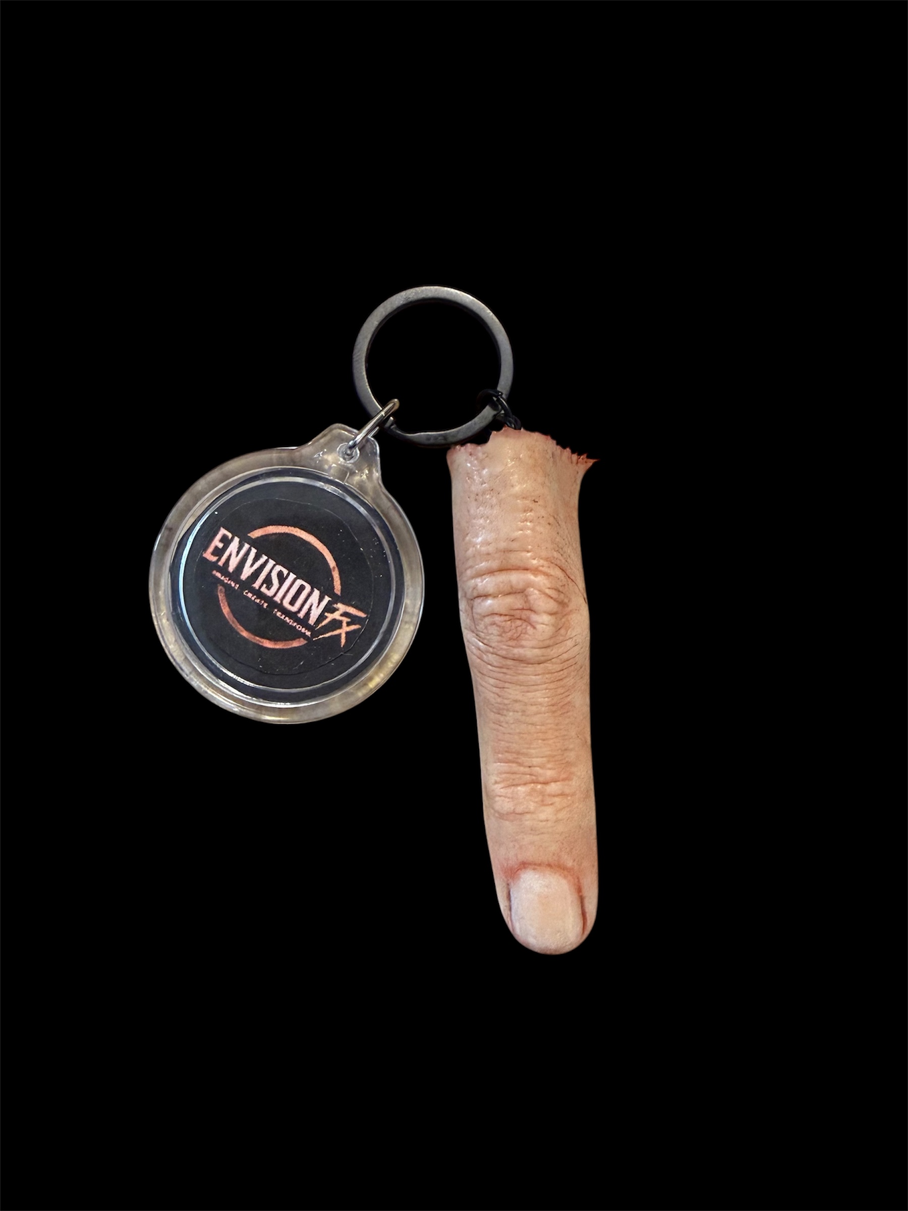 Silicone finger prop on an Envision FX branded keychain