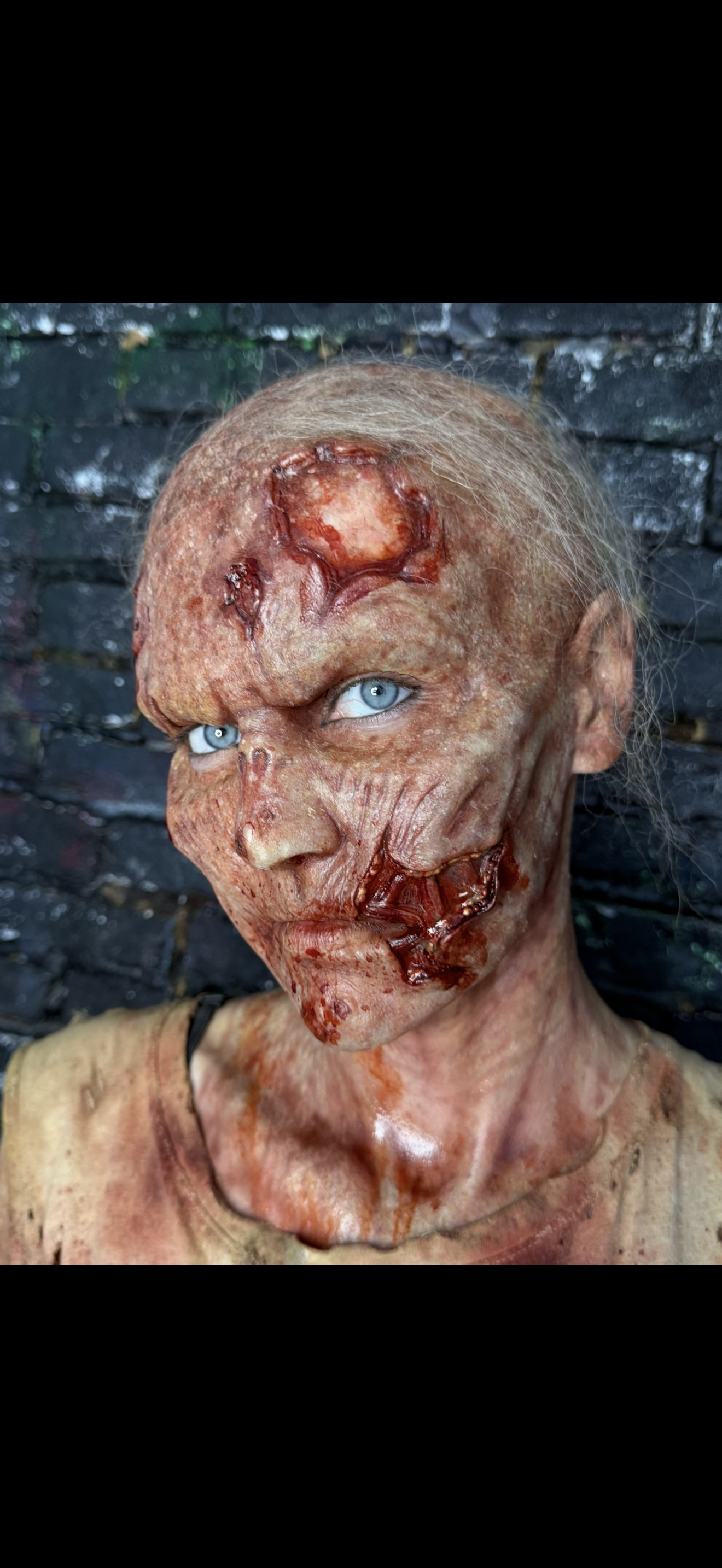 Zombie full-face prosthetic applied and painted